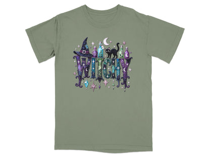 Green t-shirt with a "Witchy" graphic featuring a witch hat, potion bottles, a black cat, and stars.