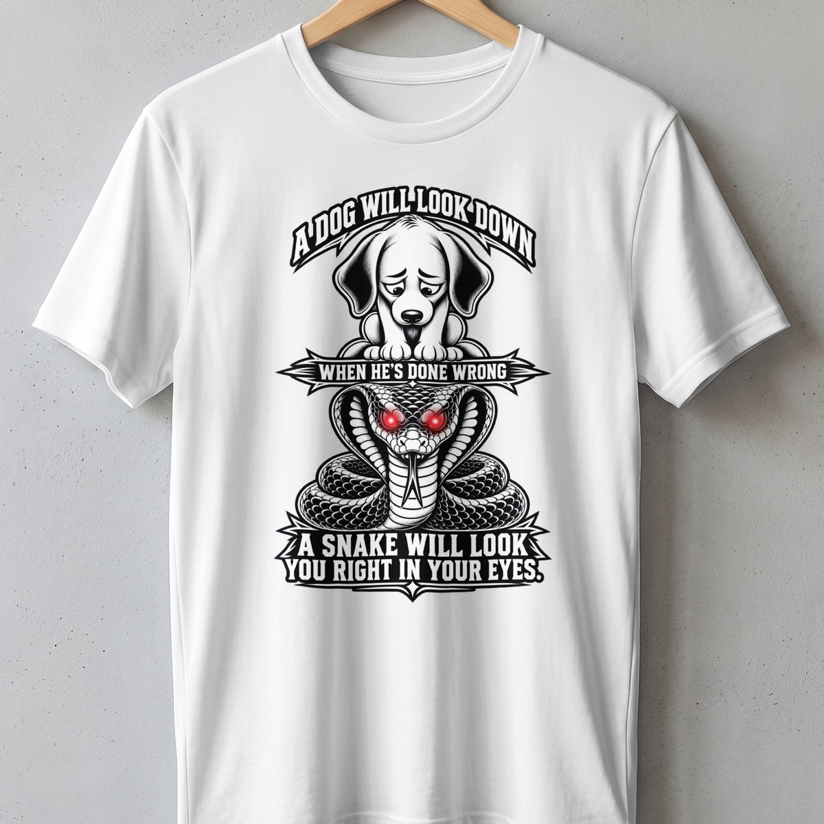 White t-shirt with black graphic: sad dog above snake, text reads "A dog will look down when he's done wrong."