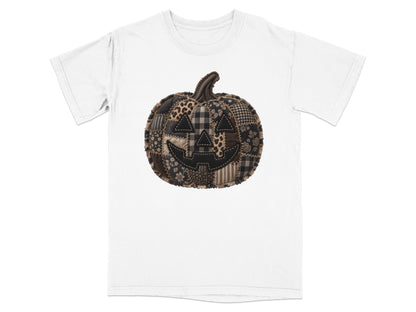 White t-shirt featuring a stitched patchwork jack-o'-lantern with a distressed design.