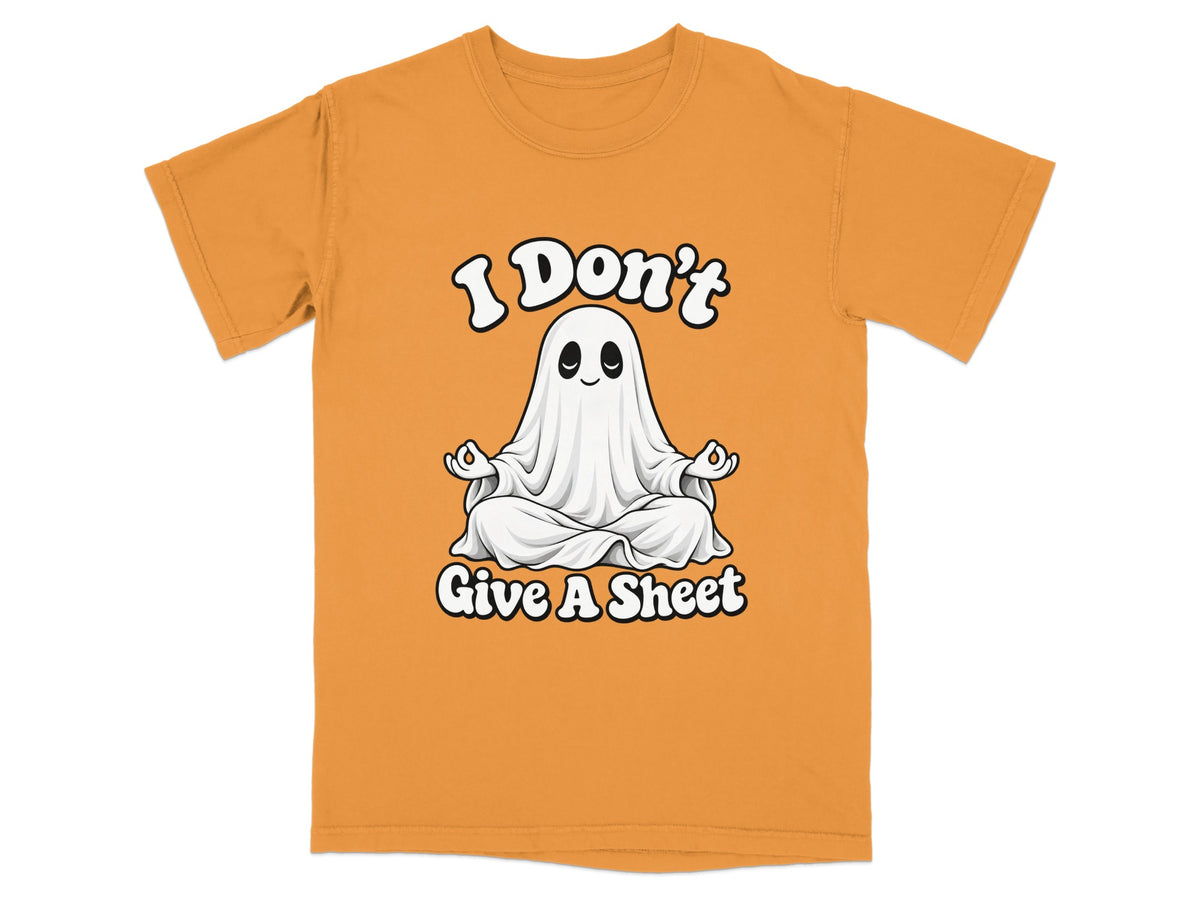 Orange t-shirt with a cartoon ghost meditating and the text "I Don't Give A Sheet".