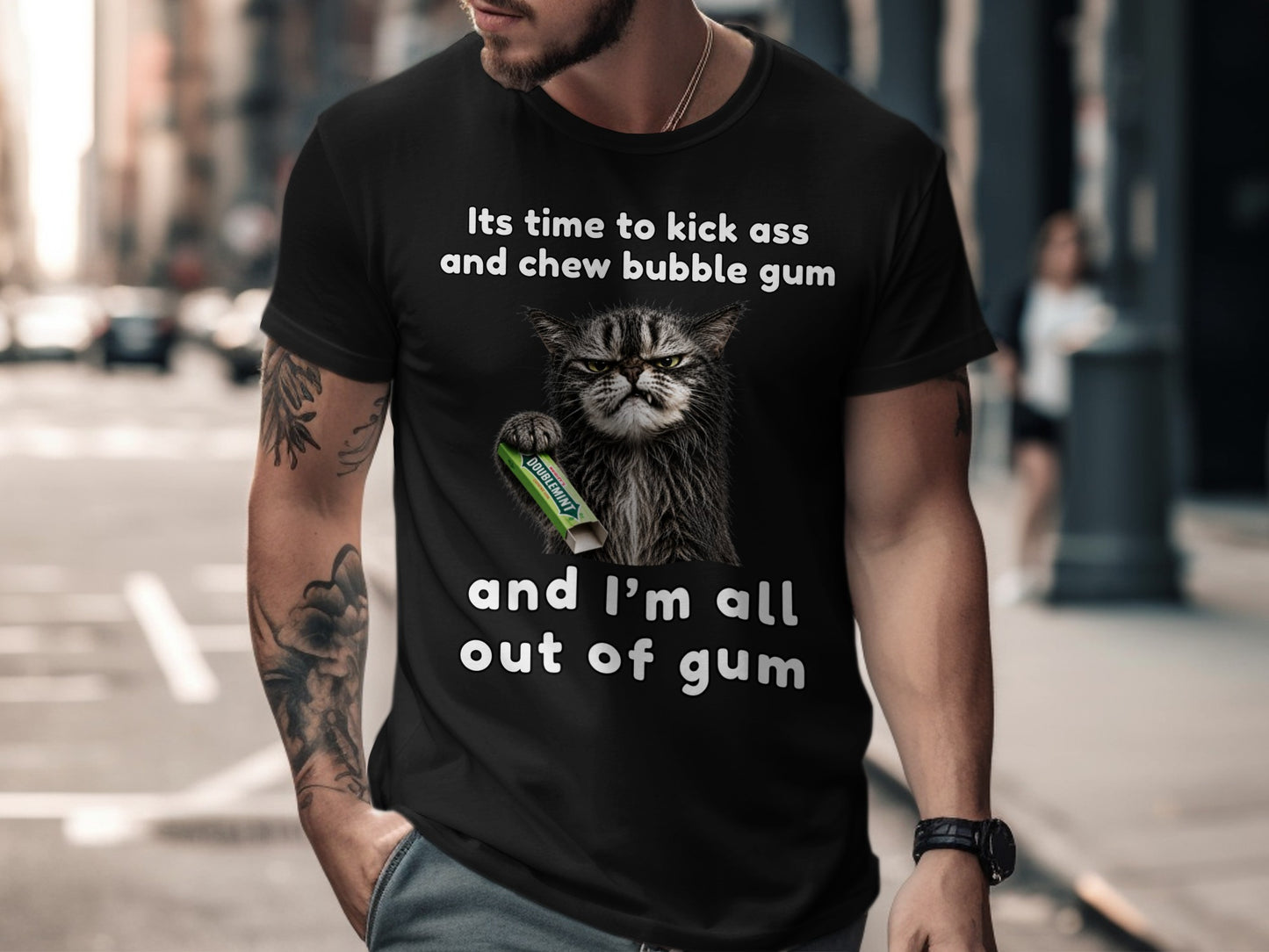 Black t-shirt with a grumpy cat holding Doublemint gum and the text "Its time to kick ass and chew bubble gum and I'm all out of gum".