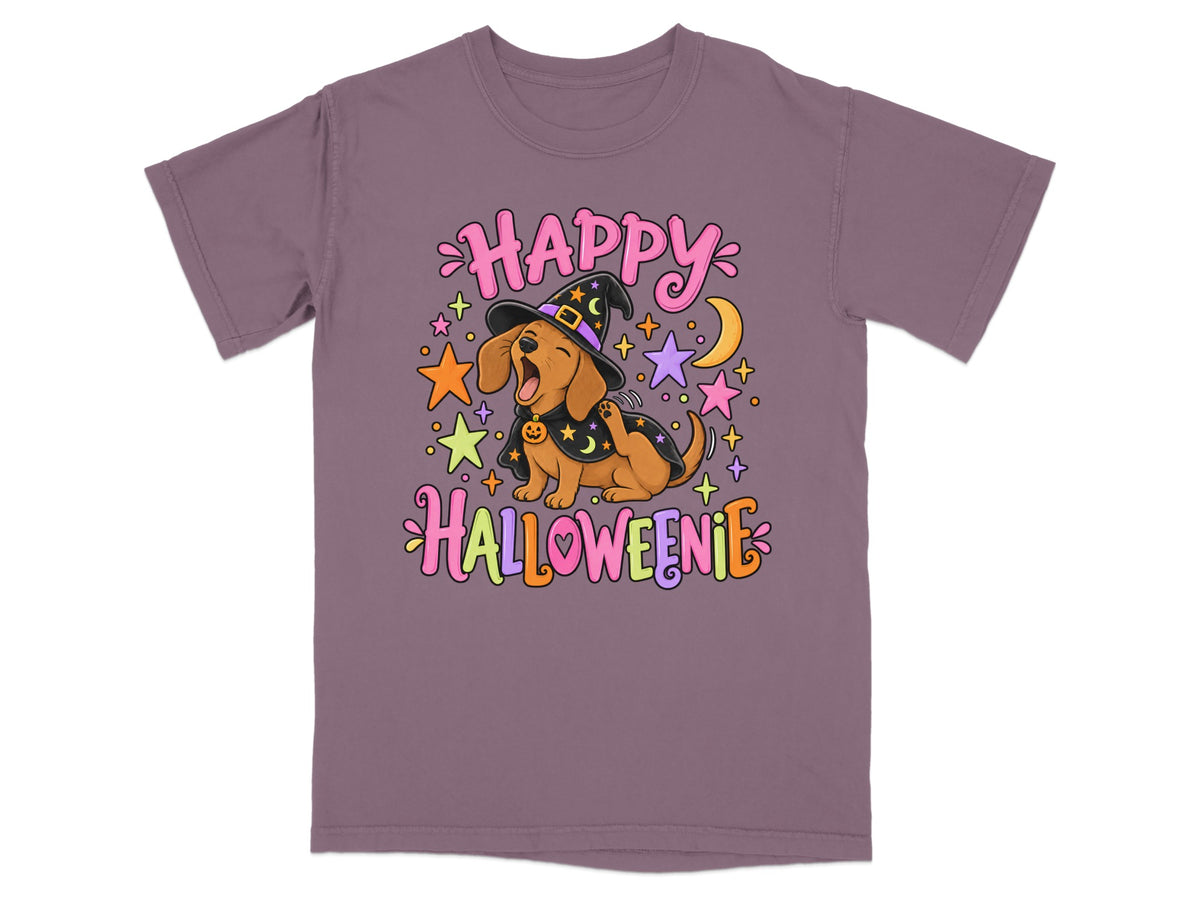 Dachshund in witch hat with "Happy Halloweenie" text, surrounded by stars and moon.