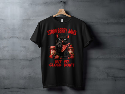 Black t-shirt with a cat wearing sunglasses holding a gun, with strawberry jam jars and strawberries.