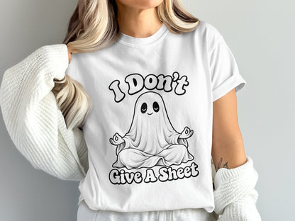 White t-shirt with black graphic of a ghost meditating and text "I Don't Give A Sheet".