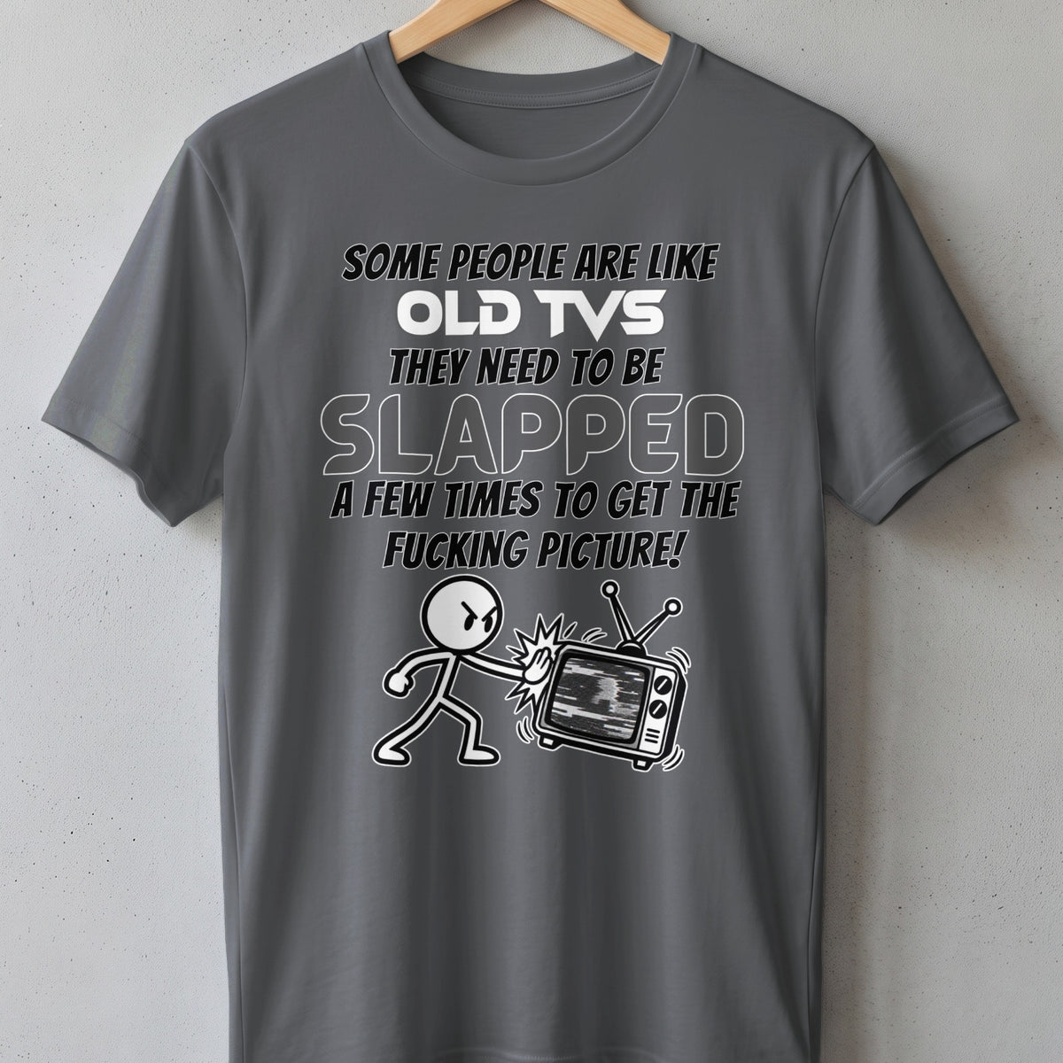 T-shirt graphic with stick figure slapping an old TV with static on screen.