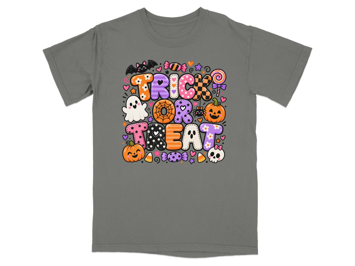 Halloween t-shirt with "Trick or Treat" text featuring pumpkins, ghosts, candy, and a bat.
