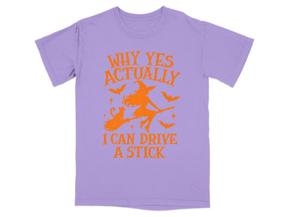 Purple t-shirt with orange Halloween graphic and text "Why Yes Actually I Can Drive A Stick".