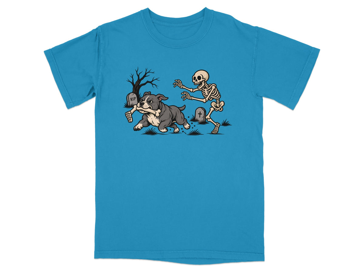 Bright blue t-shirt featuring a graphic of a bulldog running away with a skeleton arm.