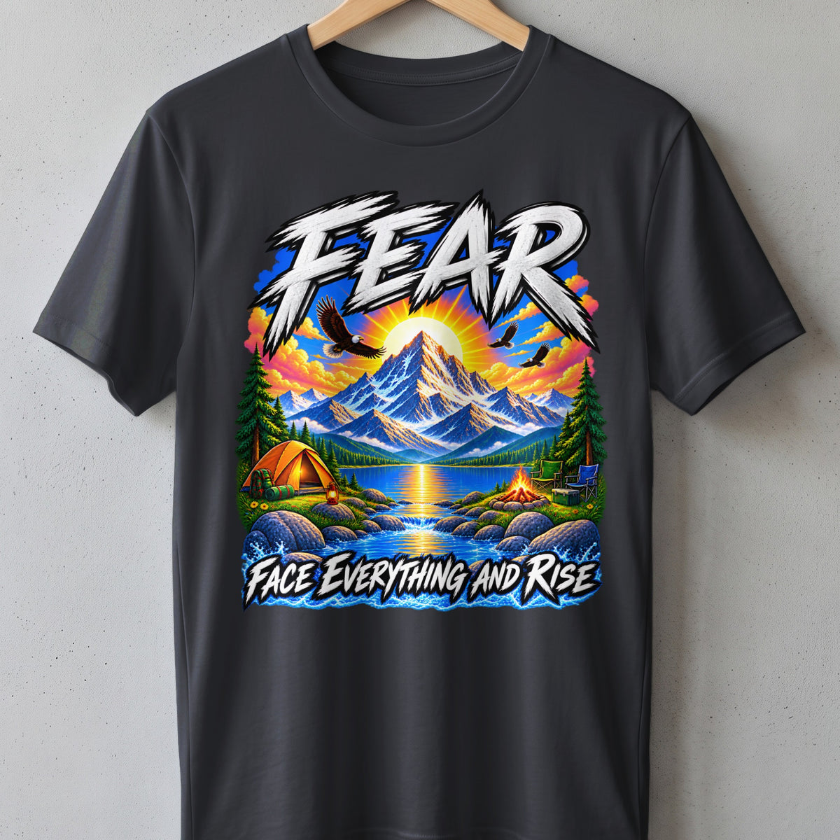 Dark t-shirt with mountain, lake, camping, and eagles graphic and text "FEAR FACE EVERYTHING AND RISE."