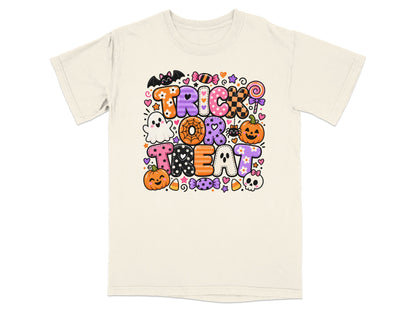 Cream t-shirt with "Trick or Treat" Halloween graphic featuring pumpkins, ghosts, and candy.