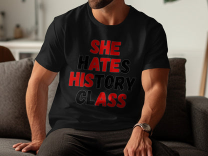 Black t-shirt with red and black text reading "SHE HATES HISTORY CLASS".