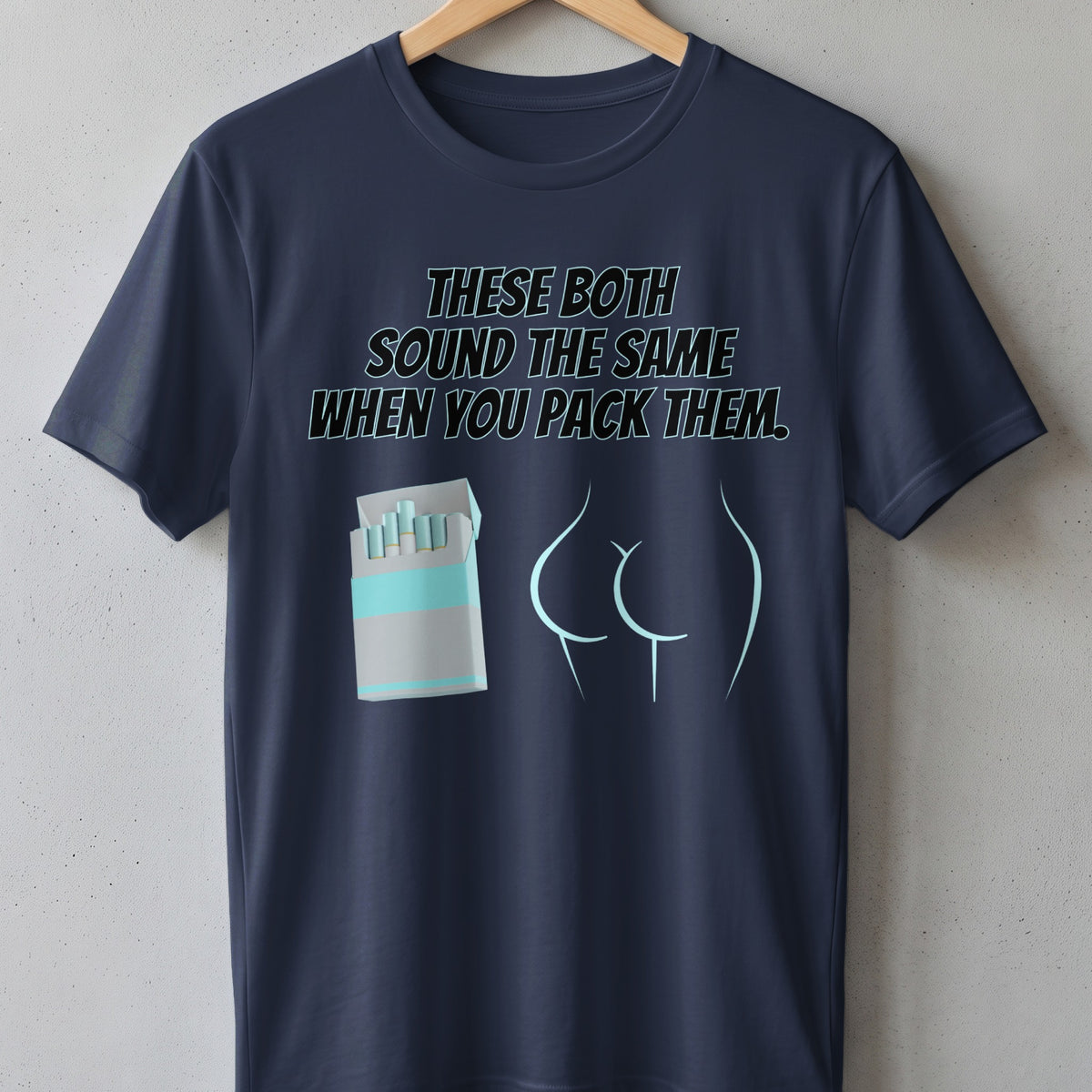 Navy t-shirt with text "These Both Sound The Same When You Pack Them" and graphics.