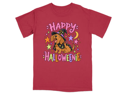 Dachshund in witch hat and cape with "Happy Halloweenie" text and stars.