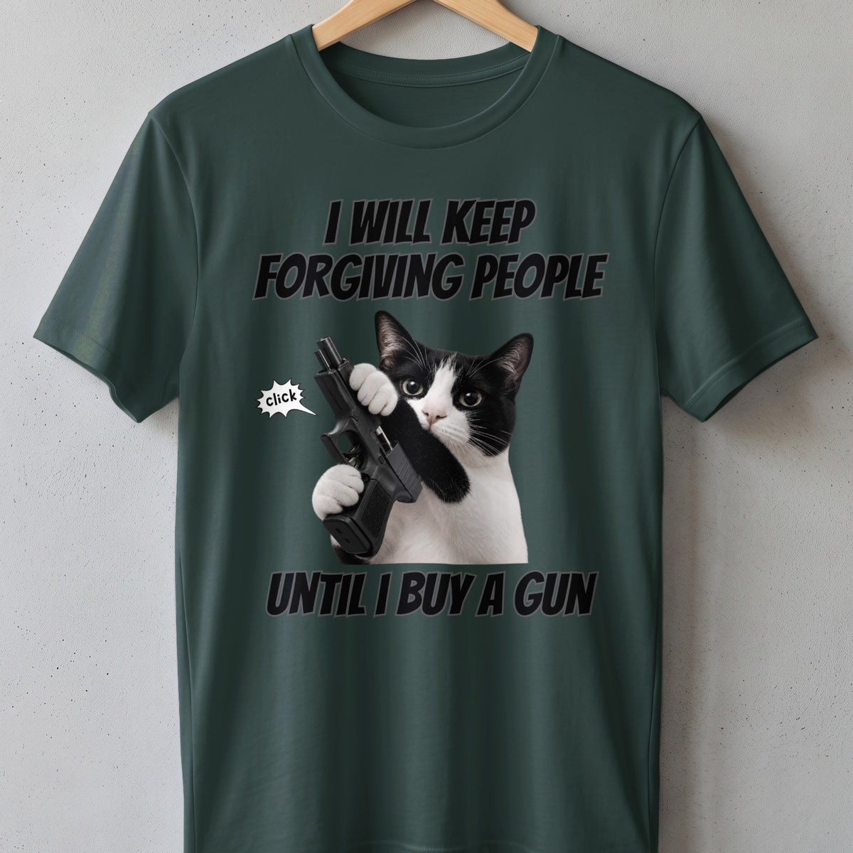 Green t-shirt with black text and a cat holding a gun.