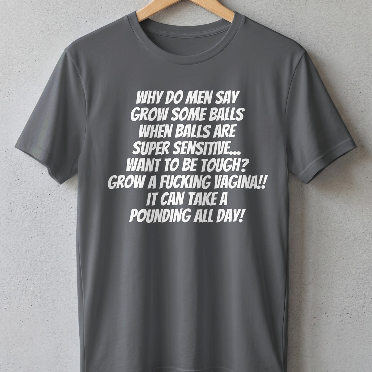 Grey t-shirt with white text: "Why do men say grow some balls when balls are super sensitive..."