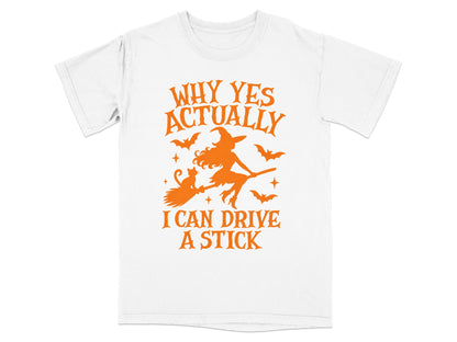 White t-shirt with orange graphic of a witch flying on a broom with bats and text.