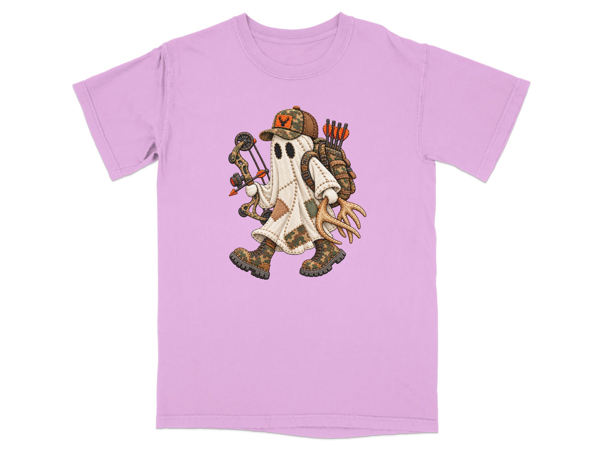 Light pink short-sleeve t-shirt featuring a cartoon illustration of a ghost hunter with a compound bow and antlers.