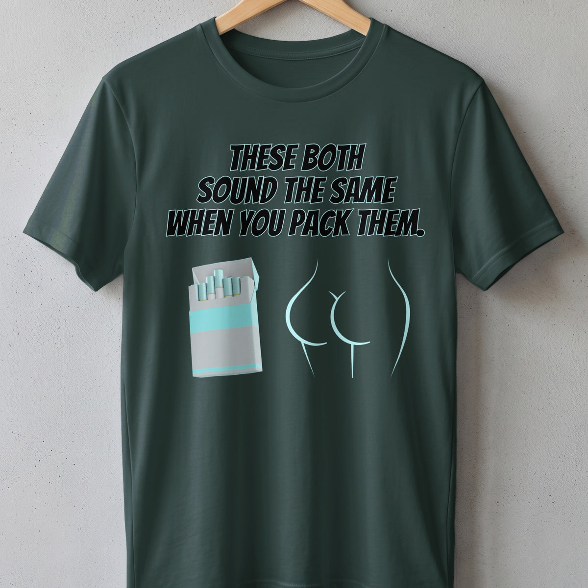 Dark green t-shirt with text "THESE BOTH SOUND THE SAME WHEN YOU PACK THEM."