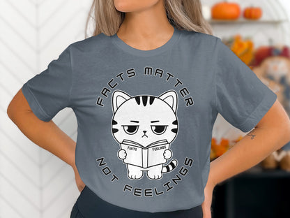 Gray t-shirt with a cartoon cat reading a book titled "Fukyo Feelings".