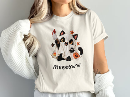 Ghost cat holding bloody knife with "Meeoww" text and Halloween icons.