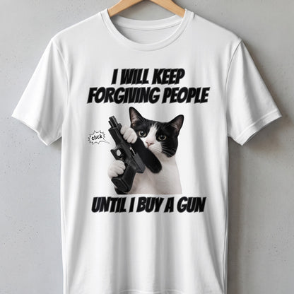 White t-shirt with black text "I WILL KEEP FORGIVING PEOPLE UNTIL I BUY A GUN" and a cat holding a gun.