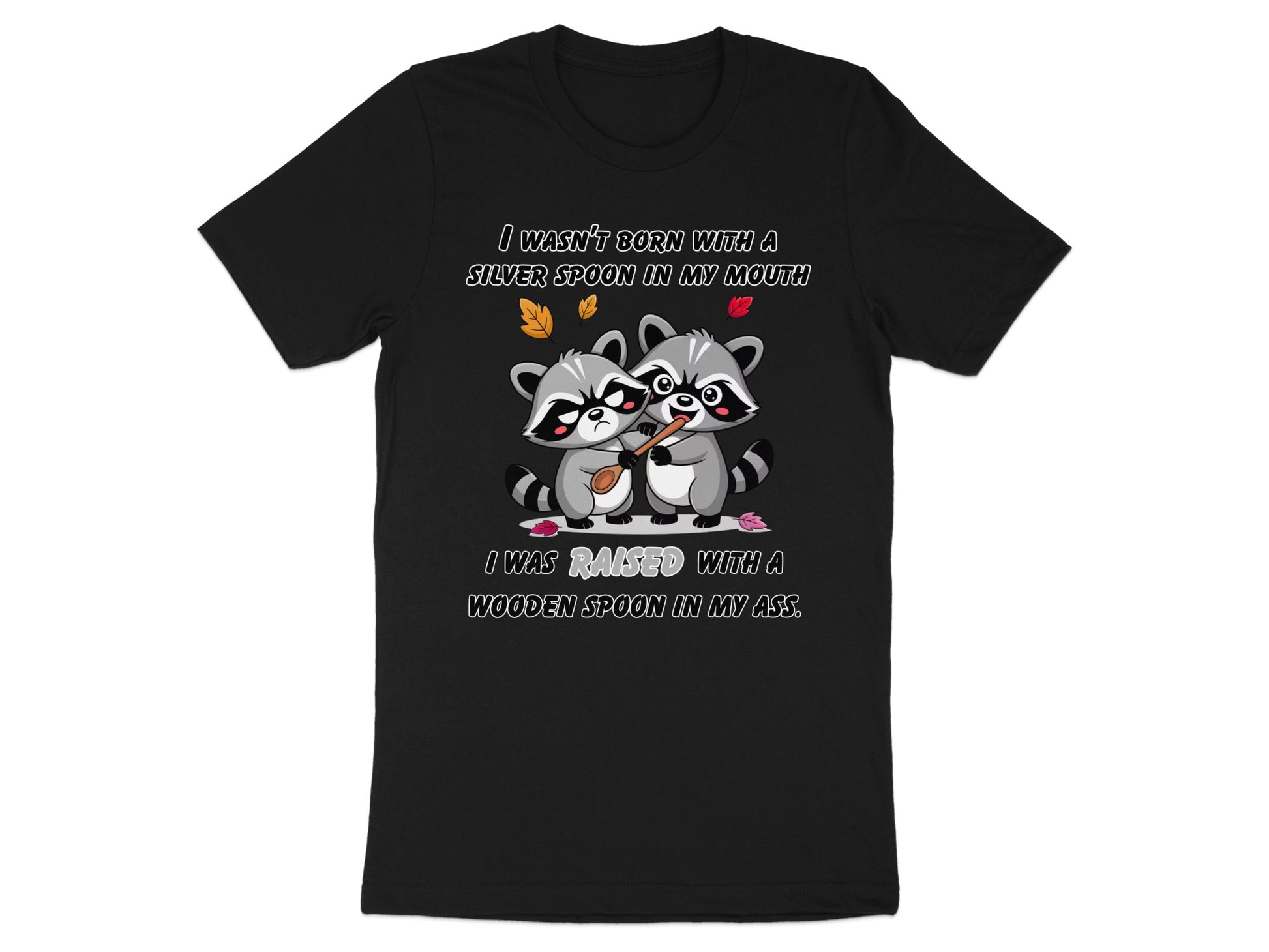 Black t-shirt with raccoons and the text "I WASN'T BORN WITH A SILVER SPOON IN MY MOUTH I WAS RAISED WITH A WOODEN SPOON IN MY ASS."