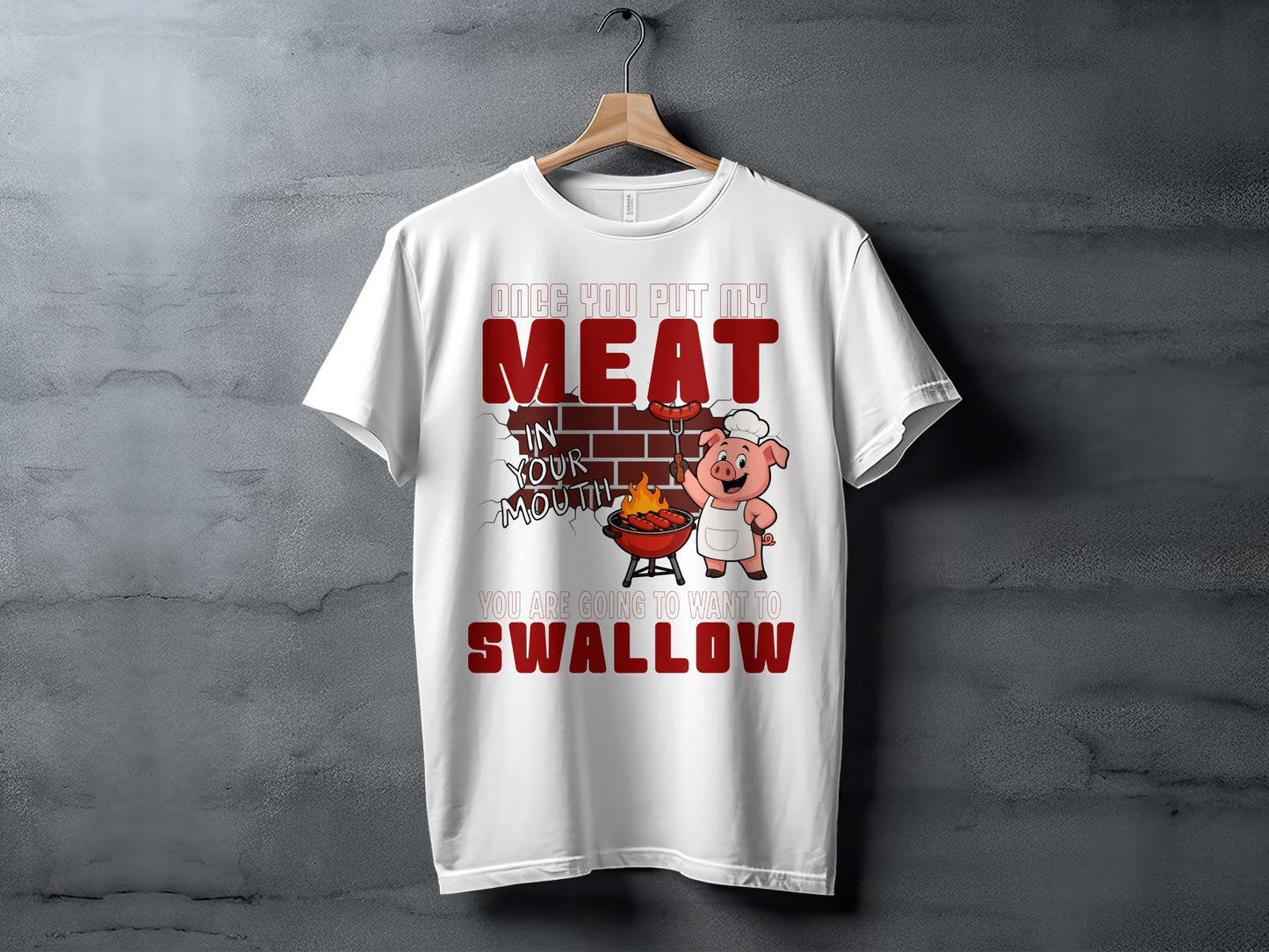 White t-shirt with cartoon pig, grill, and text about meat and swallowing.