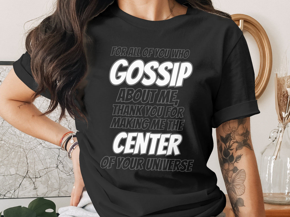 Black t-shirt with "GOSSIP ABOUT ME THANK YOU FOR MAKING ME THE CENTER OF YOUR UNIVERSE" text.