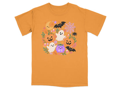 Orange t-shirt with cute Halloween characters including ghosts, pumpkins, bats, and a cauldron.