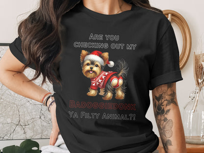 Yorkshire terrier in Santa hat and sweater with text "BADOGGIE DONK YA FILTHY ANIMAL?!"