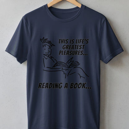 Dark blue t-shirt with illustration of person reading, "This is life's greatest pleasures... Reading a book..."