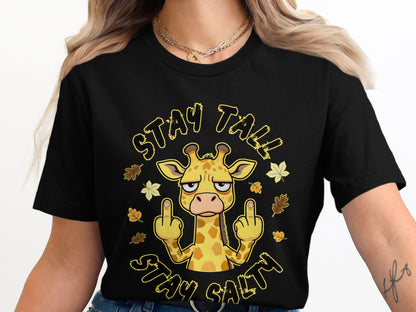 Black t-shirt with cartoon giraffe giving middle fingers, surrounded by leaves, text "STAY TALL STAY SALTY".