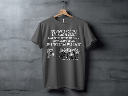 Dark gray t-shirt with text and cartoon drawing of stick figures.