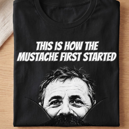 Black t-shirt with "This is how the mustache first started" and a man's face.