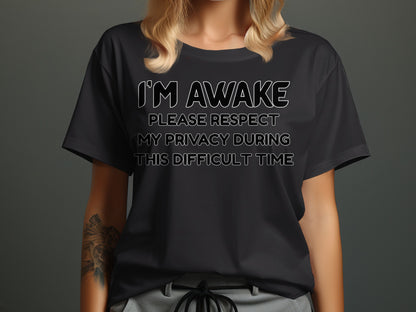 Black t-shirt with white text reading "I'M AWAKE PLEASE RESPECT MY PRIVACY DURING THIS DIFFICULT TIME".