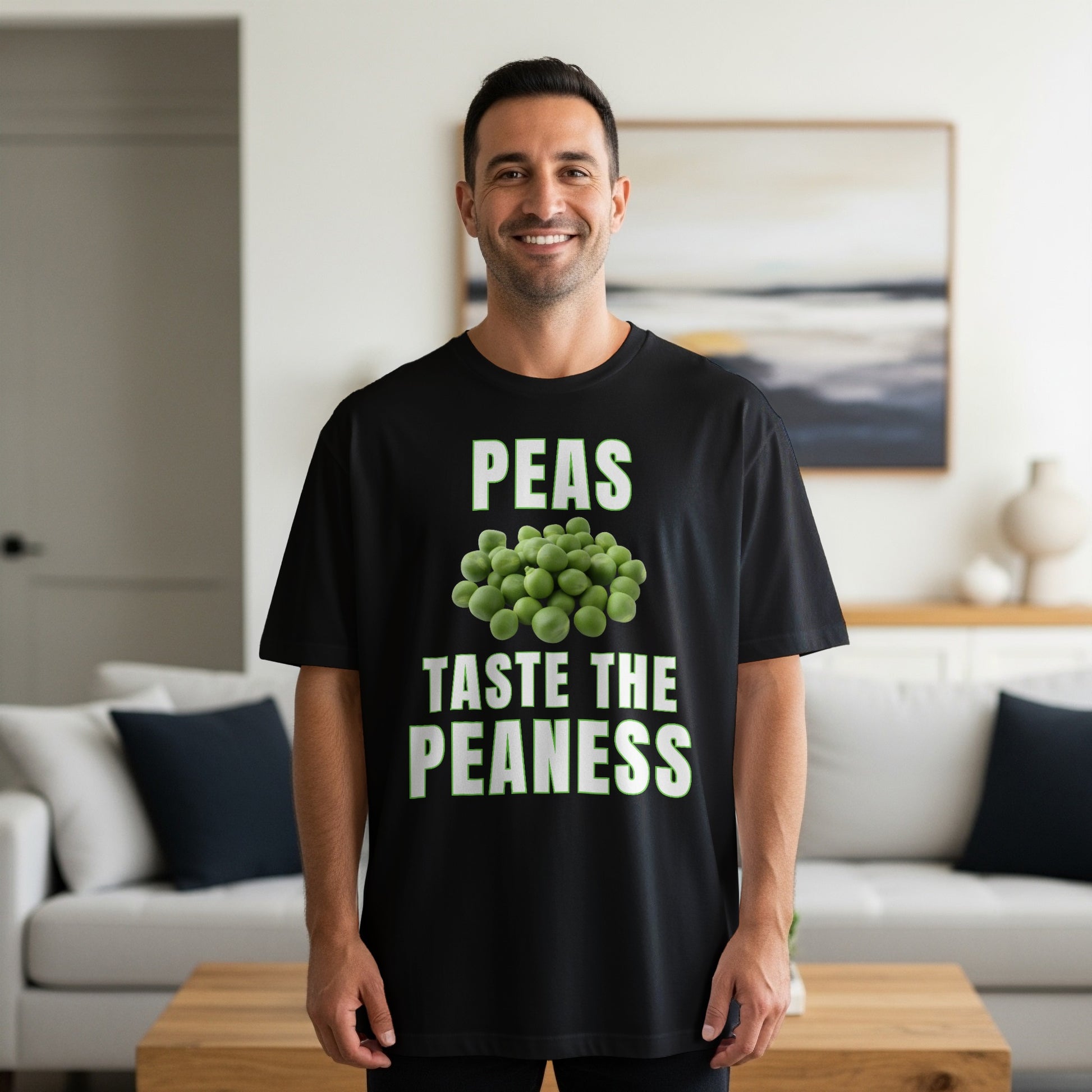 Black t-shirt with text "PEAS TASTE THE PEANESS" and a pile of peas.