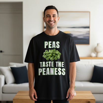 Black t-shirt with text "PEAS TASTE THE PEANESS" and a pile of peas.
