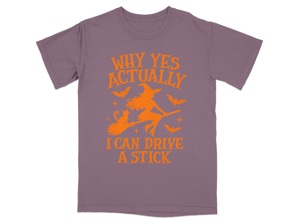 Purple t-shirt with orange Halloween graphic and text "Why Yes Actually I Can Drive A Stick."
