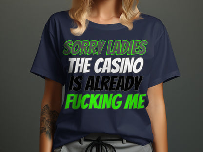 Navy t-shirt with "SORRY LADIES THE CASINO IS ALREADY FUCKING ME" text.