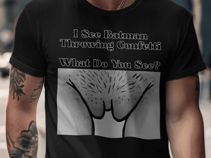 Black t-shirt with text "I See Batman Throwing Confetti" and an abstract drawing.