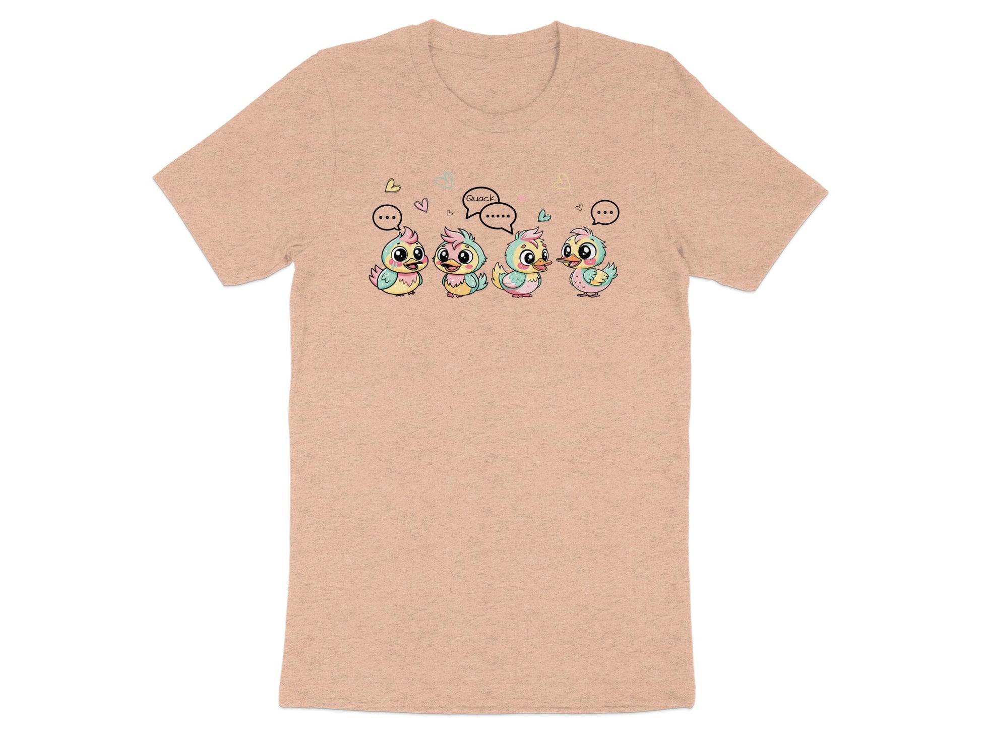Four cartoon ducklings with speech bubbles, one saying "Quack," are on a peach t-shirt.