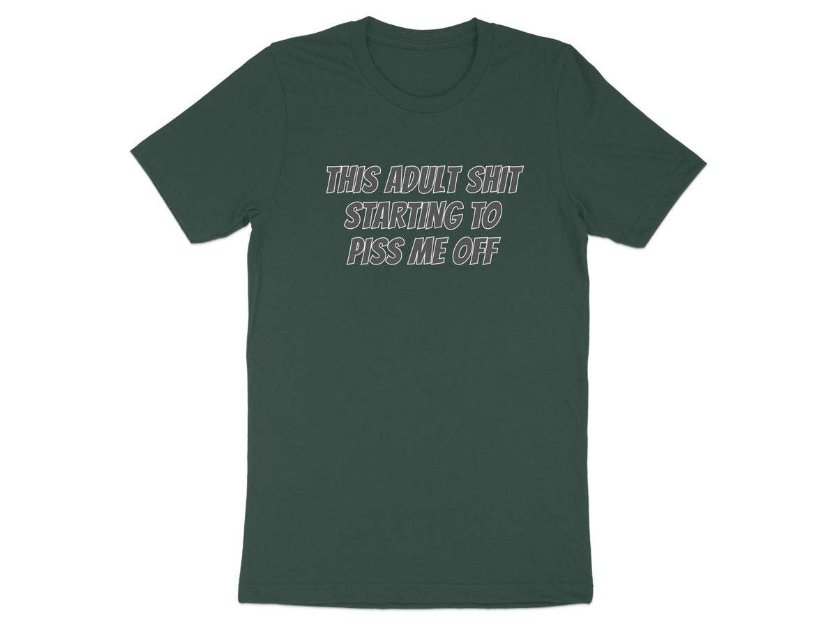 Dark green t-shirt with white text reading "THIS ADULT SHIT STARTING TO PISS ME OFF".