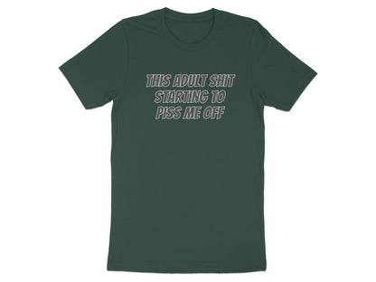 Dark green t-shirt with white text reading "THIS ADULT SHIT STARTING TO PISS ME OFF".