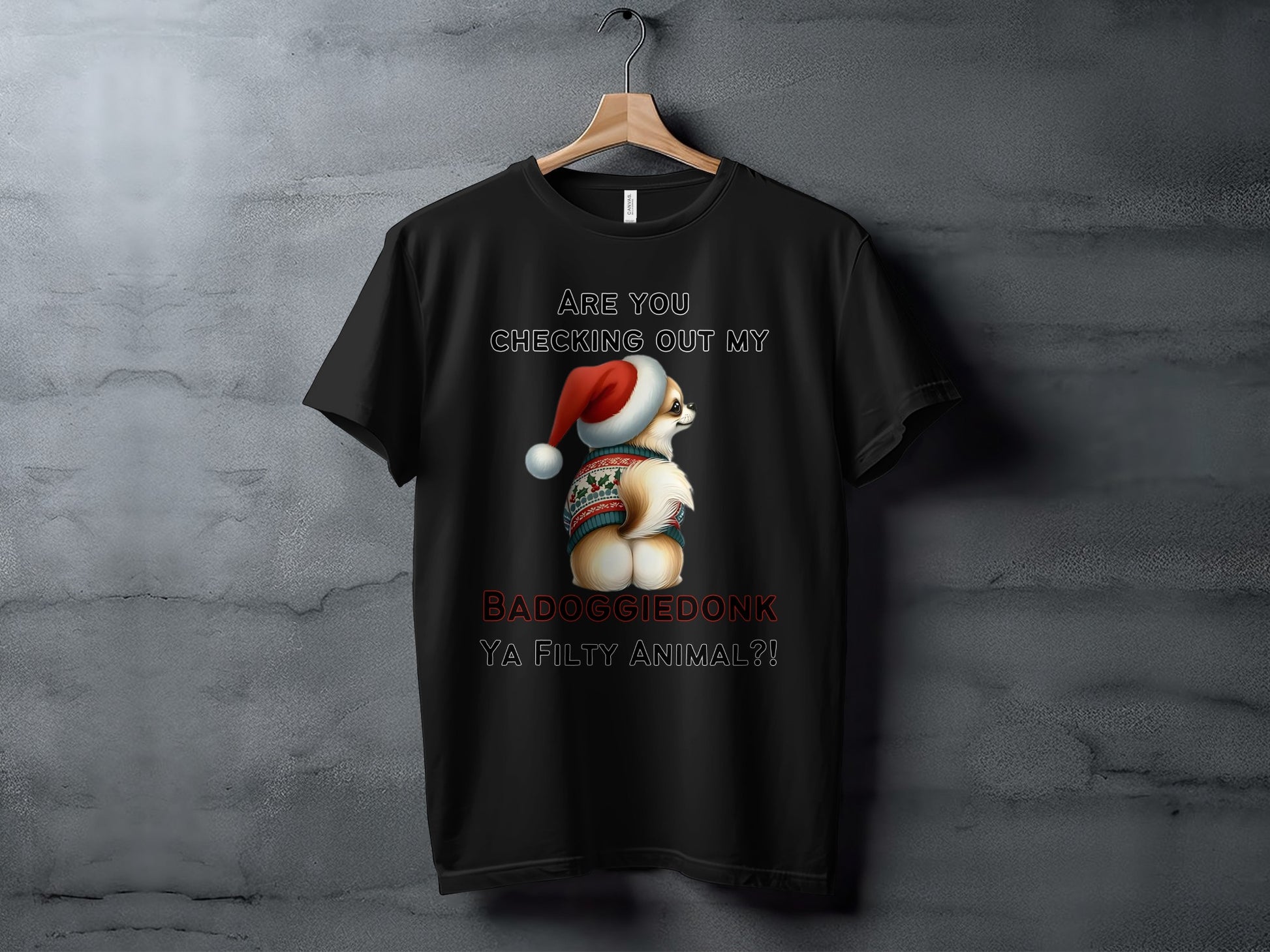 Black t-shirt with a dog wearing a Santa hat and ugly Christmas sweater, with text.