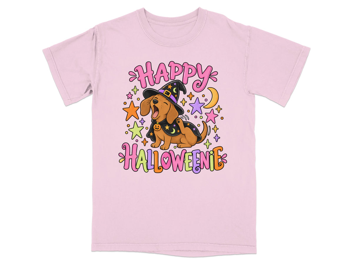 Pink t-shirt with cartoon dachshund wearing witch hat and cape, saying Happy Halloweenie.