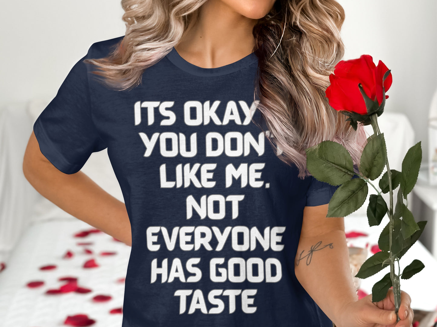Navy t-shirt with white text that reads "ITS OKAY YOU DON'T LIKE ME. NOT EVERYONE HAS GOOD TASTE."