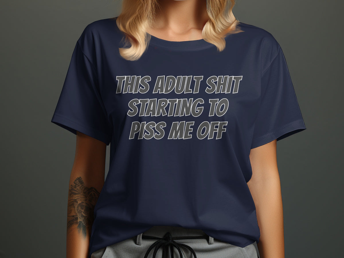 Navy t-shirt with white text reading "THIS ADULT SHIT STARTING TO PISS ME OFF".