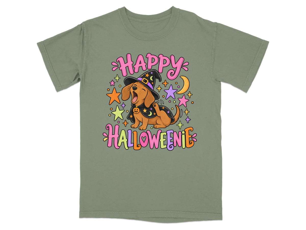 Dachshund wearing witch hat and cape with "Happy Halloweenie" text and stars.