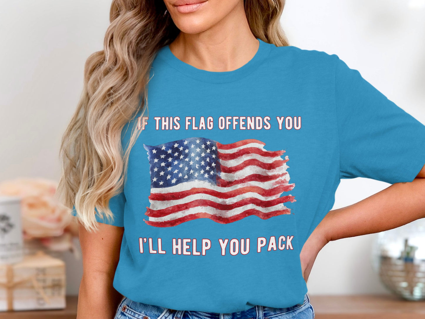 Turquoise t-shirt with distressed American flag and text "IF THIS FLAG OFFENDS YOU I'LL HELP YOU PACK".