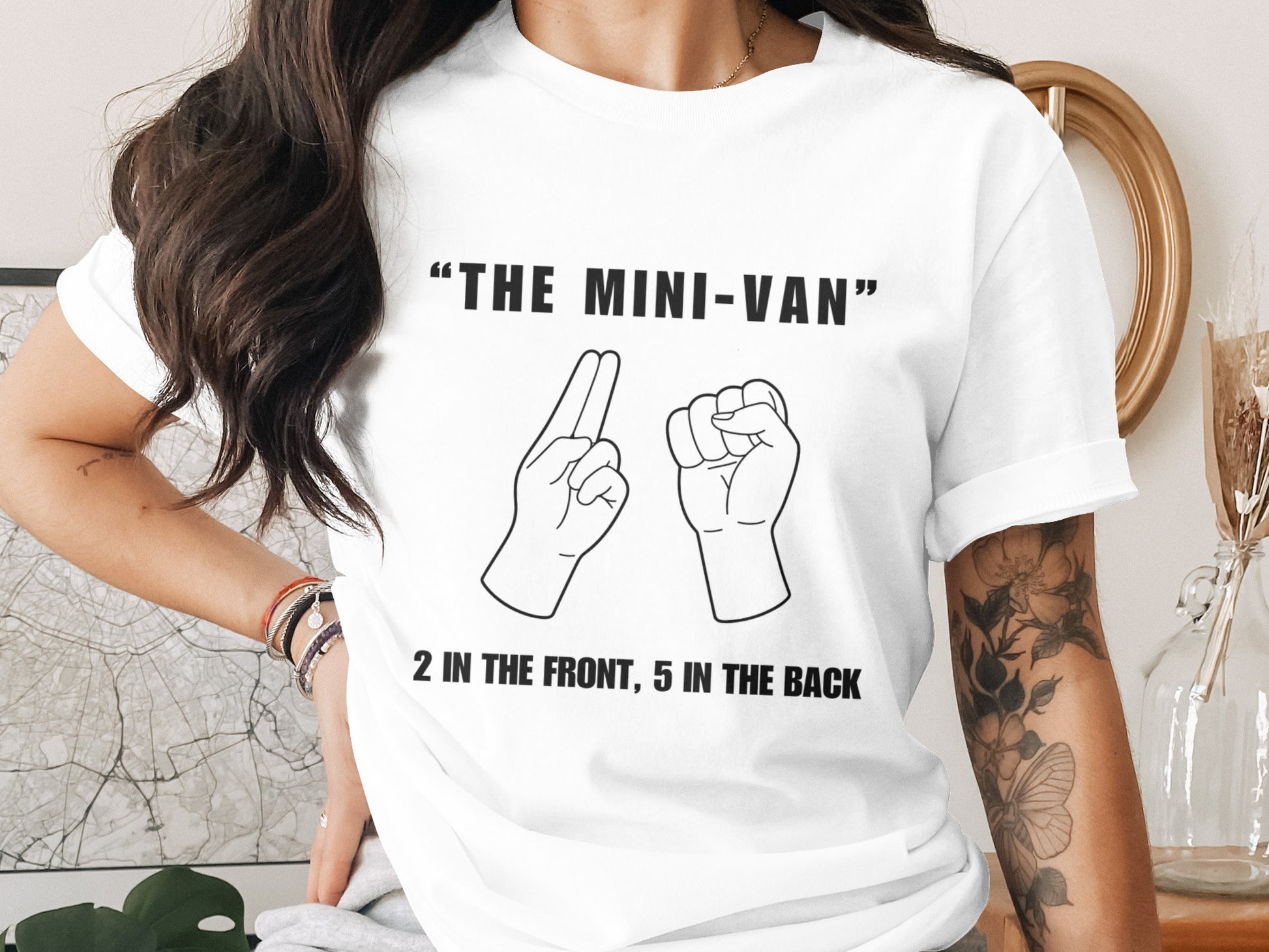 White t-shirt with "THE MINI-VAN" and hands illustrating "2 in the front, 5 in the back".